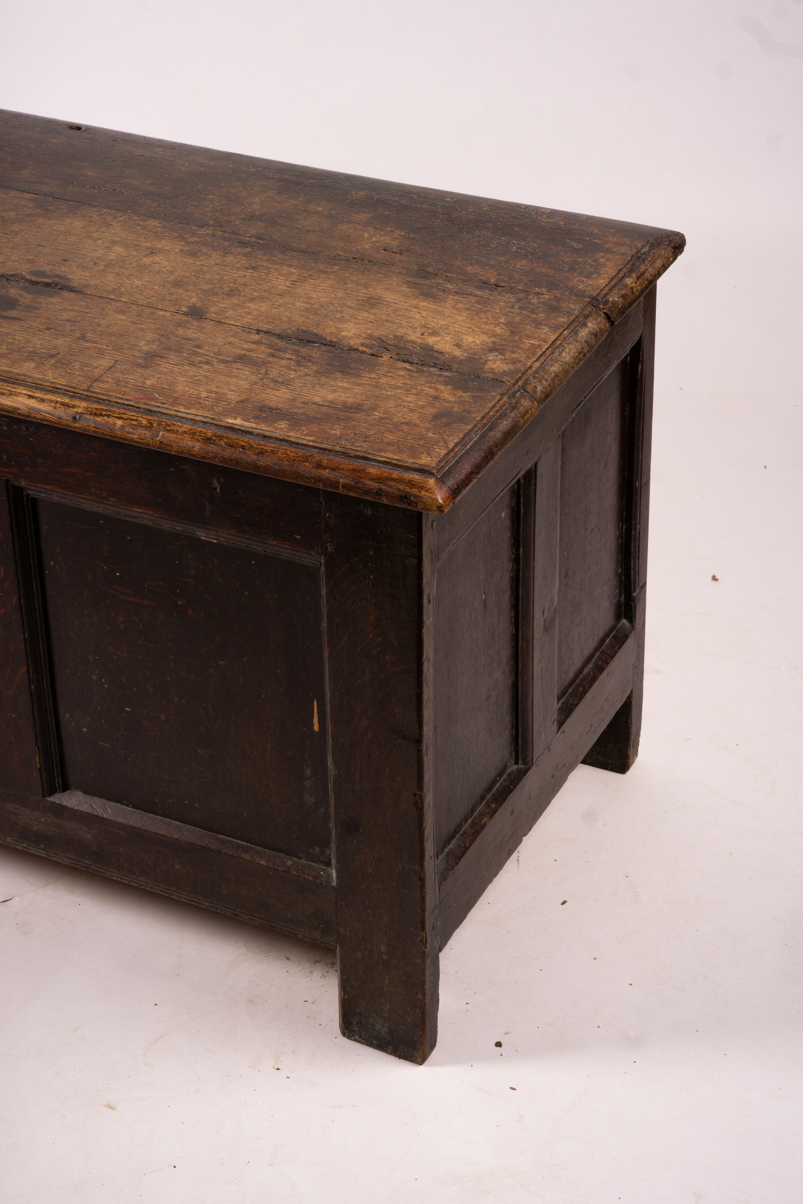 A 17th century panelled oak coffer, length 136cm, depth 56cm, height 64cm